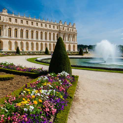 Park and fountain at the palace of Versailles in sunny day.