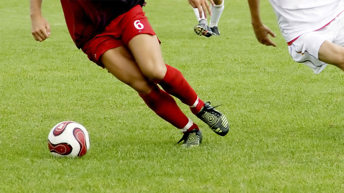 Player kicking the ball