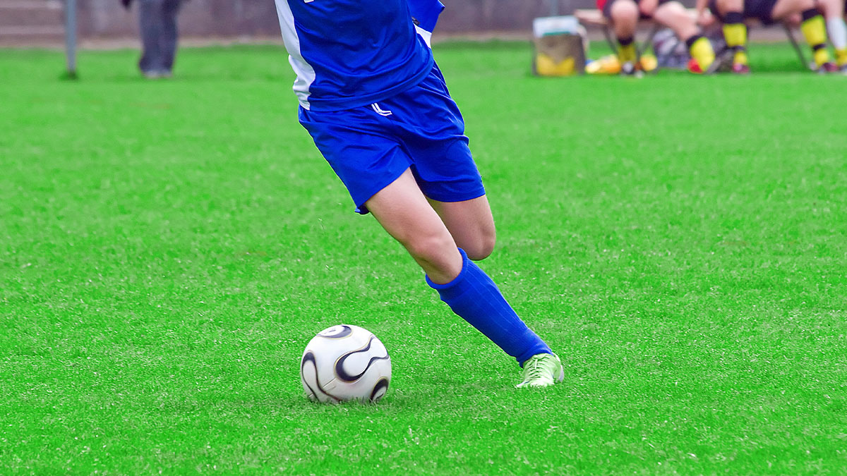 Player kicking the ball