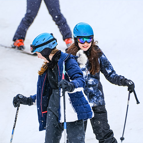 First time skiiers enjoying the slopes at Bardonecchia in Italy