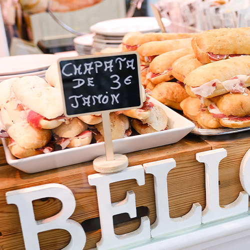 Spanish breakfast rolls on a market stall.