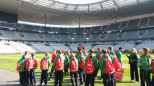 Students walk by the side of the Stade de France pitch on a Rayburn Tours Sports Tour