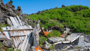 Ruin of a house damaged by flowing lava on island of Heimaey in Iceland. Ruin of a house damaged by flowing lava during the 1973 eruption on island of Heimaey in Iceland