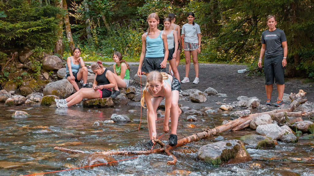 Kids in a on stepping stones in Morzine