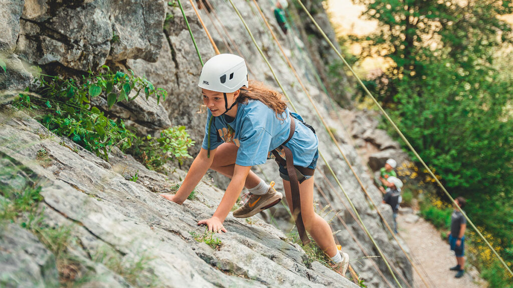 A girl rock climbing in Morzine