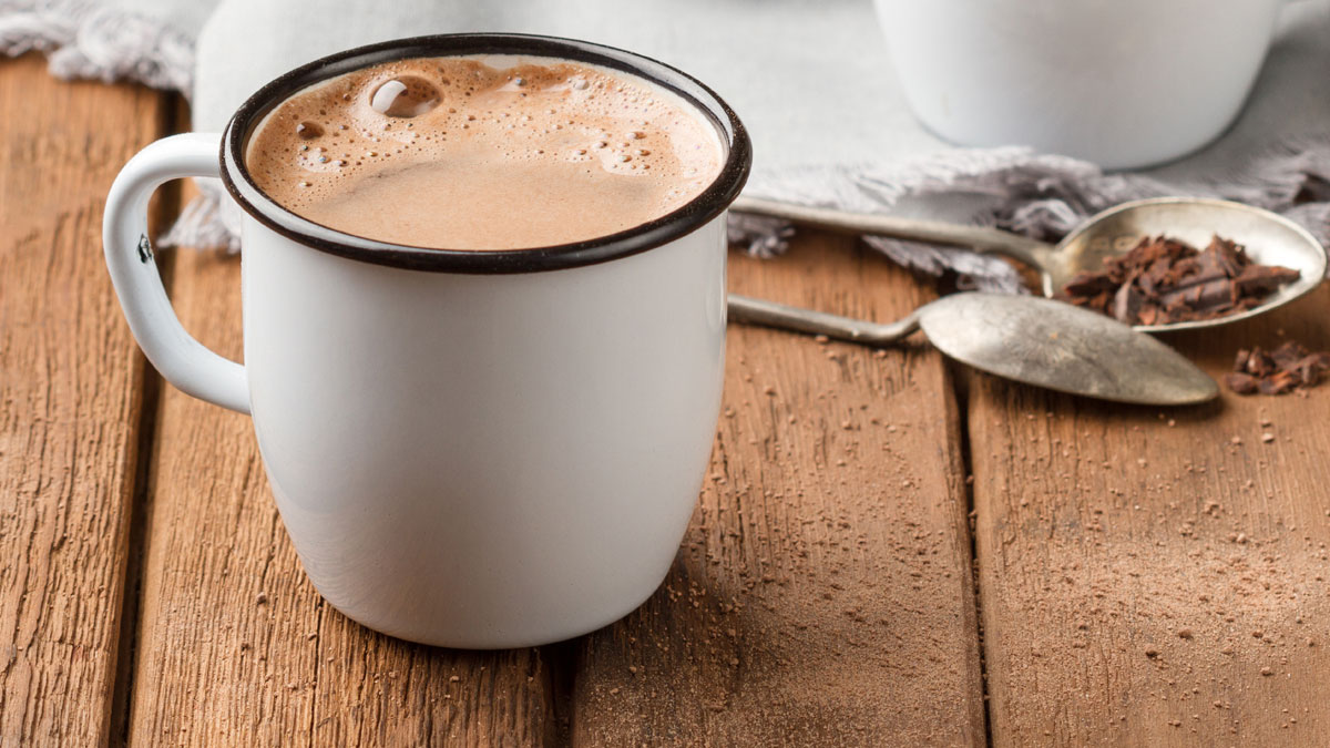 Hot chocolate with foam in two mugs.