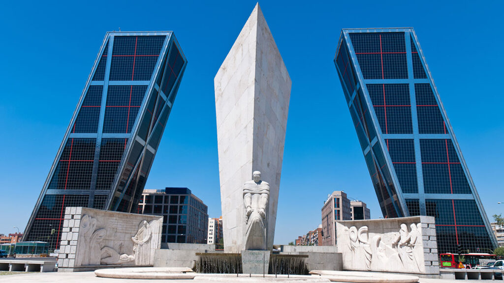 KIO Towers in Madrid, Spain. The Puerta de Europa towers (Gate of Europe or just Torres KIO) are twin office buildings in Madrid, Spain. Have a height of 114 m (374 ft) and 26 floors. Constructed from 1989 to 1996.